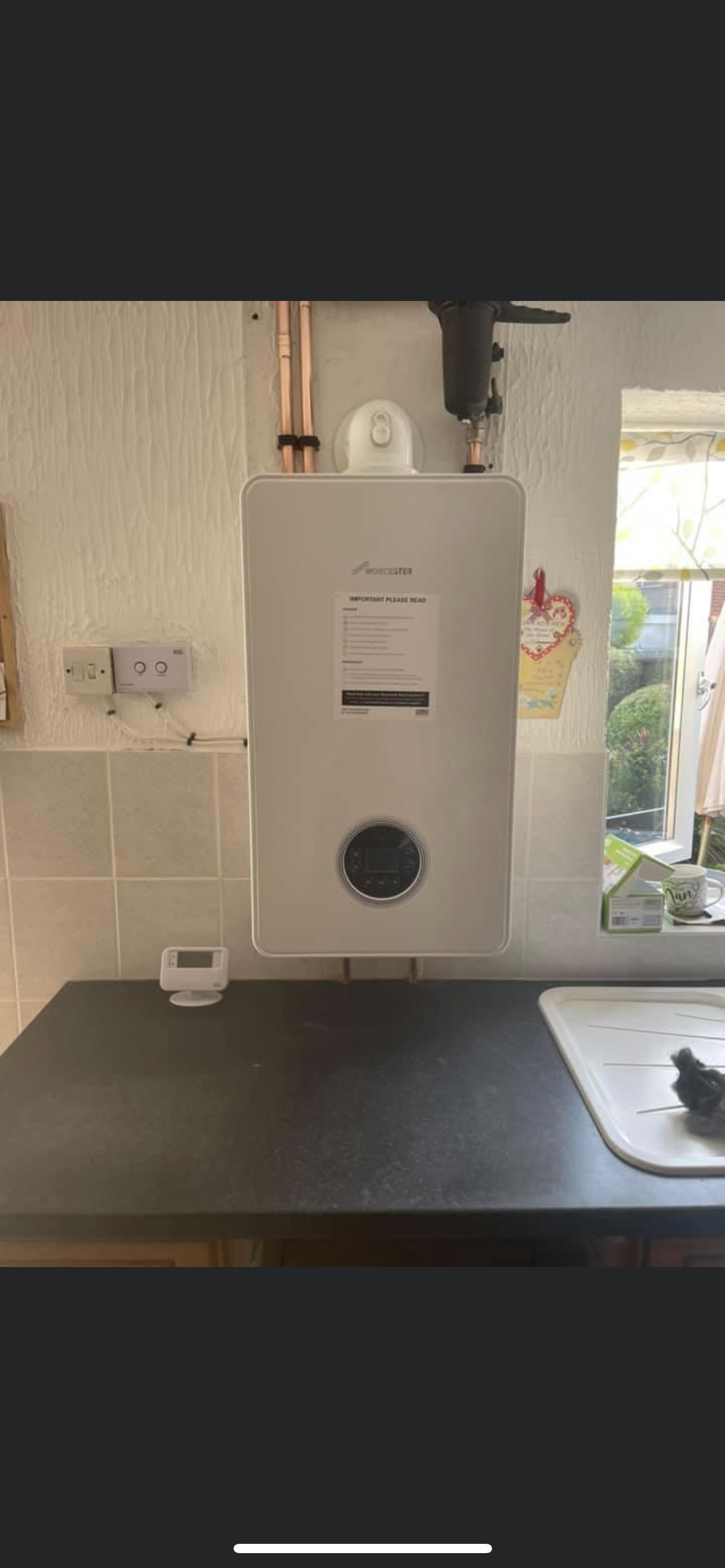 A finished Worcester boiler installed by SH Gas & Plumbing, with tidy copper pipework